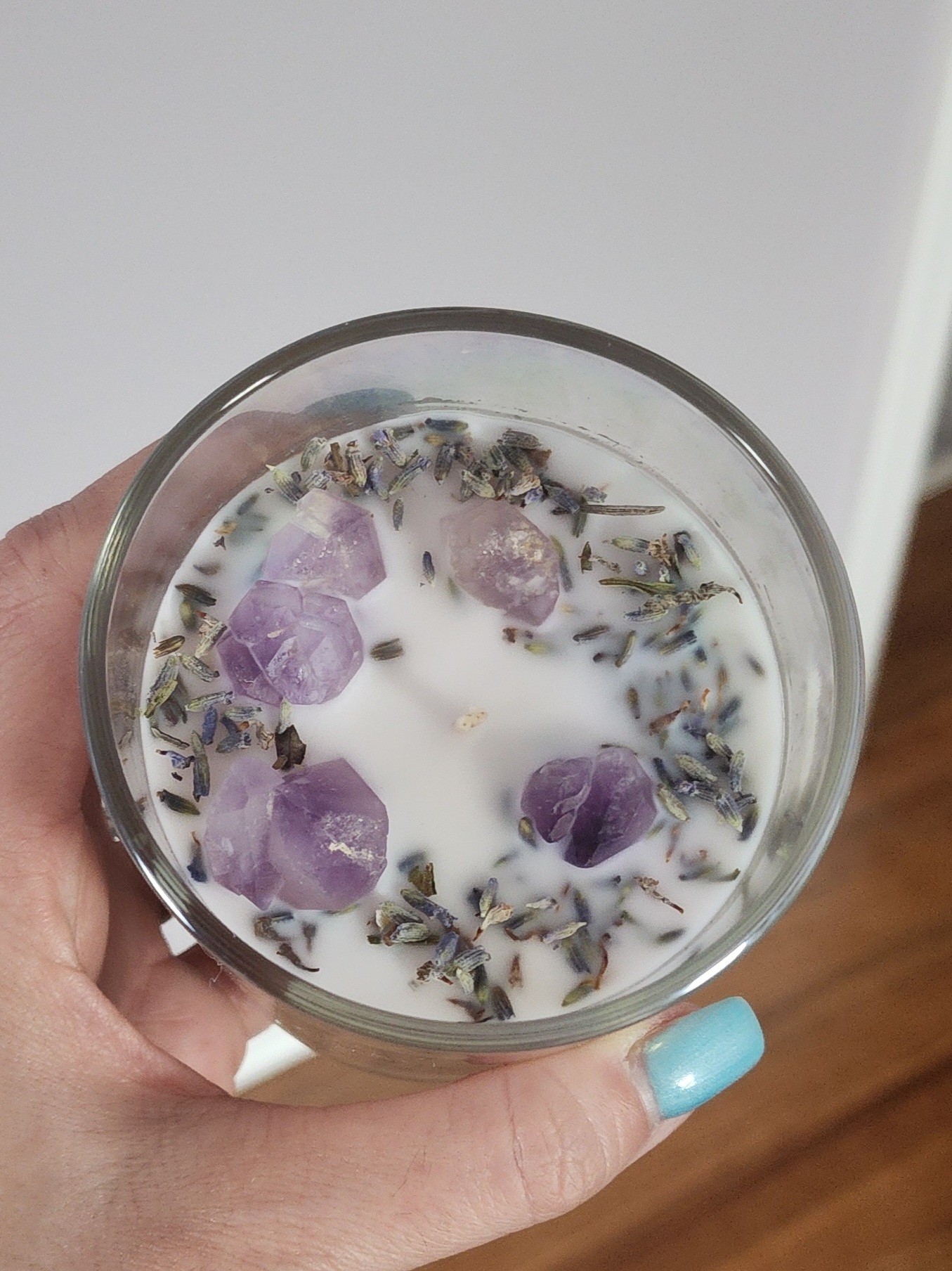 10oz glass coconut wax candles infused with lavender essential oil, amethyst crystals and dried lavender flowers.